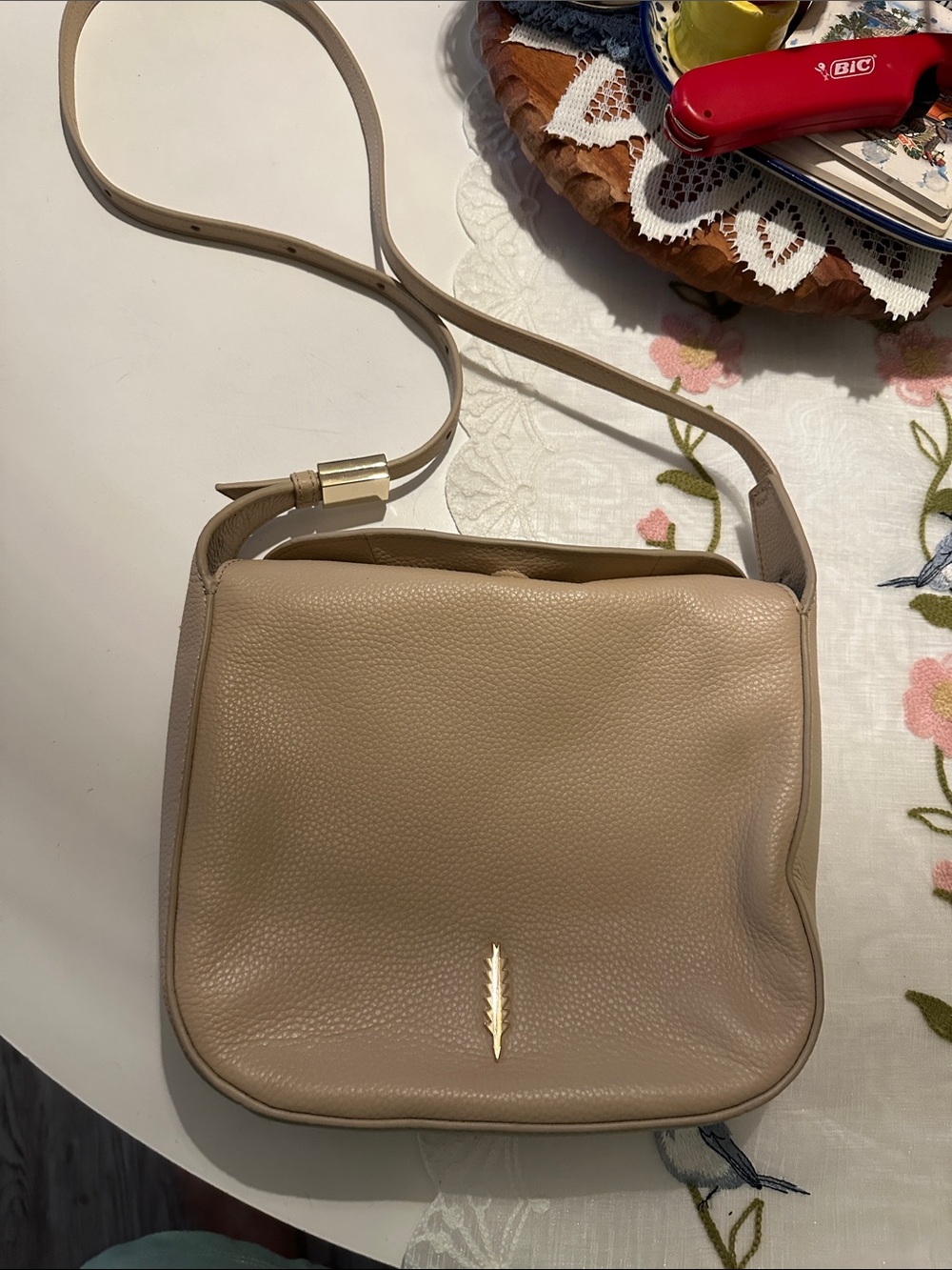 Pebbled Taupe Crossbody Bag with Gold Feather Accent